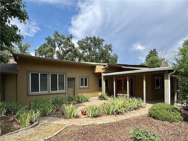 8 Geneva Ln, Chico, CA 95926 - rear view of property featuring stucco siding and a patio area