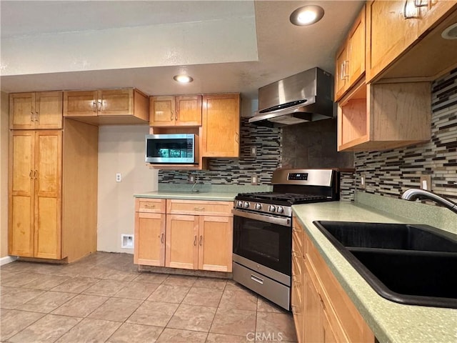 8 Geneva Ln, Chico, CA 95926 - kitchen with appliances with stainless steel finishes, wall chimney range hood, a sink, light countertops, and decorative backsplash