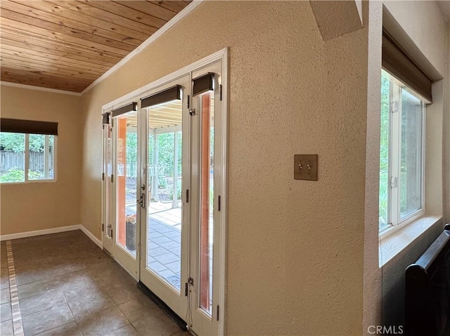 8 Geneva Ln, Chico, CA 95926 - doorway to outside featuring ornamental molding, a textured wall, wooden ceiling, baseboards, and tile patterned floors