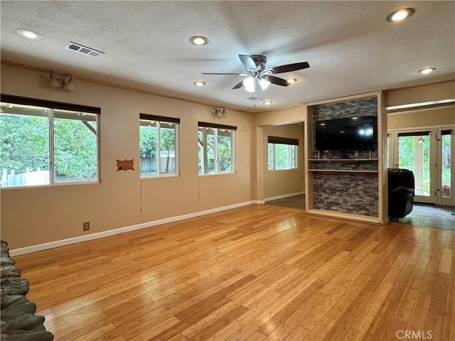 8 Geneva Ln, Chico, CA 95926 - unfurnished living room with a ceiling fan, a textured ceiling, baseboards, light wood-style floors, and recessed lighting