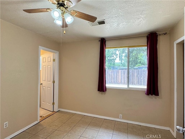 8 Geneva Ln, Chico, CA 95926 - tiled empty room with a textured ceiling, ceiling fan, and baseboards