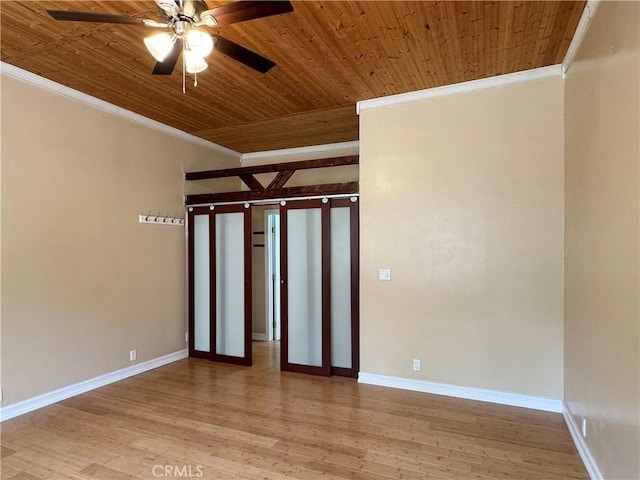 8 Geneva Ln, Chico, CA 95926 - spare room featuring crown molding, wooden ceiling, light wood-style flooring, a ceiling fan, and baseboards