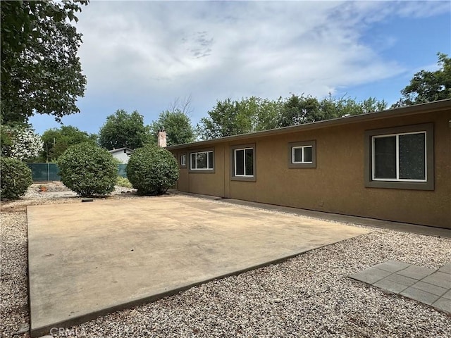 8 Geneva Ln, Chico, CA 95926 - rear view of house featuring a patio and stucco siding