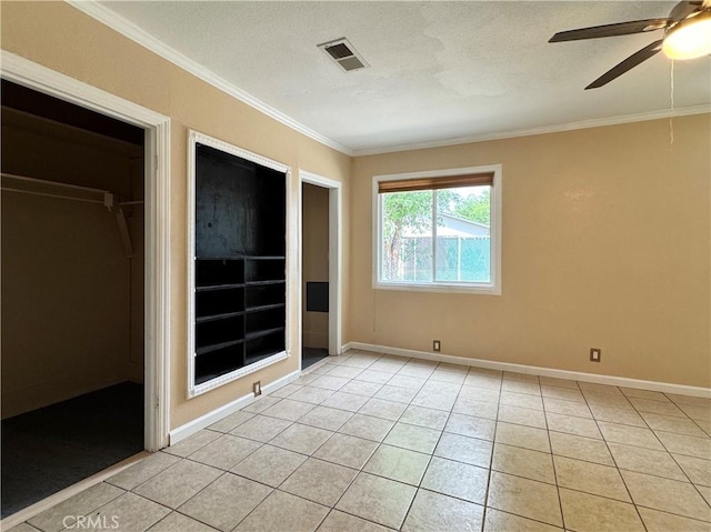8 Geneva Ln, Chico, CA 95926 - unfurnished bedroom featuring ornamental molding, light tile patterned floors, baseboards, ceiling fan, and a textured ceiling