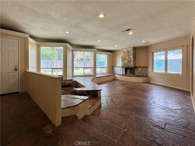 8 Geneva Ln, Chico, CA 95926 - living room featuring a textured ceiling, a fireplace, and recessed lighting