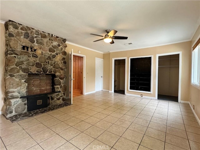 8 Geneva Ln, Chico, CA 95926 - unfurnished living room featuring light tile patterned floors, a ceiling fan, crown molding, baseboards, and a fireplace