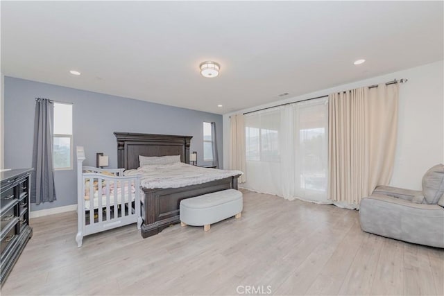1189 Canyon Glen Rd, Chino Hills, CA 91709 - bedroom with light wood-type flooring, multiple windows, baseboards, and access to exterior