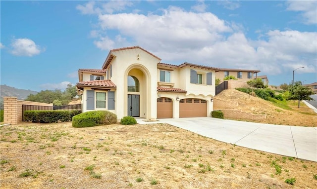 1189 Canyon Glen Rd, Chino Hills, CA 91709 - mediterranean / spanish-style house with a garage, driveway, stucco siding, and a tile roof