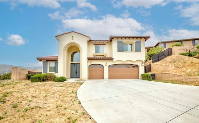 1189 Canyon Glen Rd, Chino Hills, CA 91709 - mediterranean / spanish house featuring a tile roof, stucco siding, concrete driveway, and an attached garage