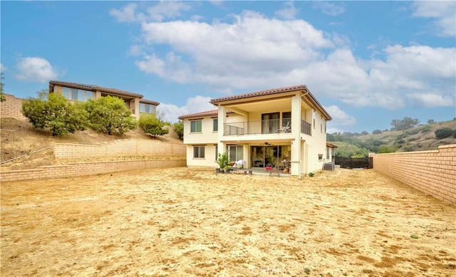 1189 Canyon Glen Rd, Chino Hills, CA 91709 - back of house with a balcony, a ceiling fan, stucco siding, and a fenced backyard