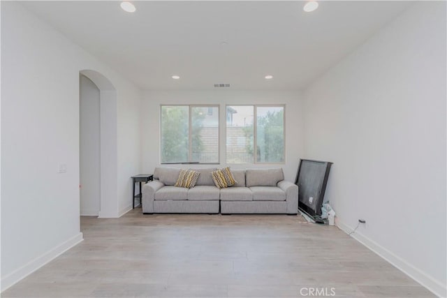 1189 Canyon Glen Rd, Chino Hills, CA 91709 - living room with recessed lighting, light wood finished floors, arched walkways, and baseboards