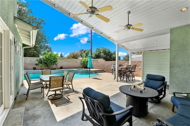 374 N Elm St, Orange, CA 92868 - fenced backyard with outdoor dining area, a fire pit, a patio area, and ceiling fan