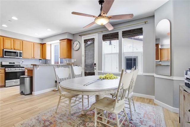 4533 Filson St, Riverside, CA 92507 - dining space featuring healthy amount of natural light, recessed lighting, light wood-style flooring, arched walkways, and a ceiling fan