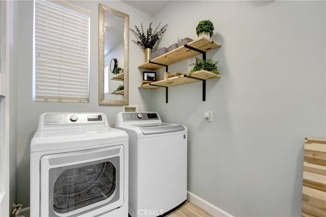 4533 Filson St, Riverside, CA 92507 - laundry room with washing machine and clothes dryer, baseboards, and light wood-style floors