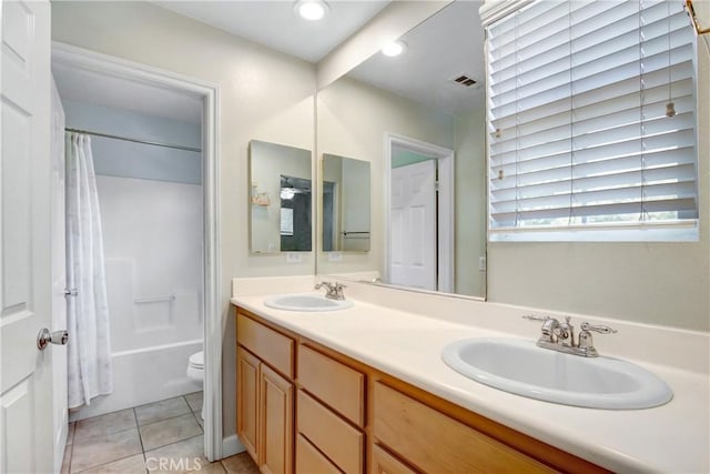 4533 Filson St, Riverside, CA 92507 - bathroom featuring double vanity, toilet, shower / tub combo, tile patterned flooring, and recessed lighting