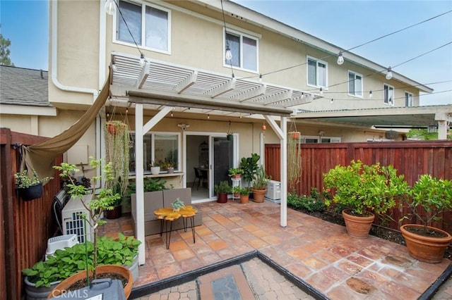 3021 S Sycamore St Unit D, Santa Ana, CA 92707 - back of house with a pergola, a patio area, a fenced backyard, and stucco siding