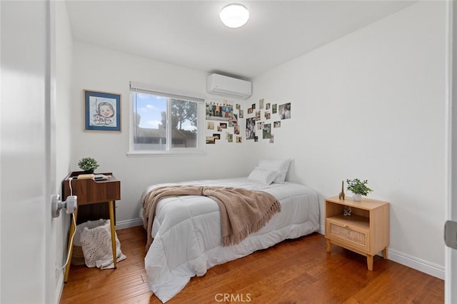 3021 S Sycamore St Unit D, Santa Ana, CA 92707 - bedroom with a wall unit AC and wood finished floors