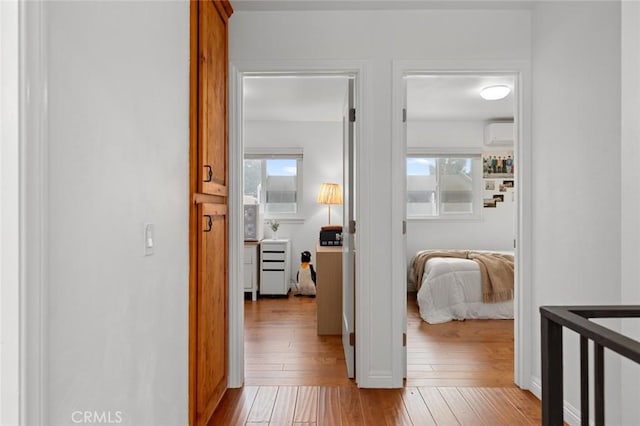 3021 S Sycamore St Unit D, Santa Ana, CA 92707 - hall featuring a wall mounted air conditioner and wood-type flooring