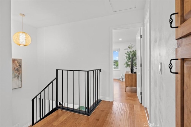 3021 S Sycamore St Unit D, Santa Ana, CA 92707 - hallway with an upstairs landing and light wood-style floors