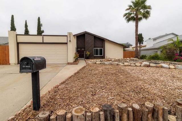 1242 Pleasant Hill St, Escondido, CA 92026 - mid-century modern home with stucco siding, concrete driveway, and a garage