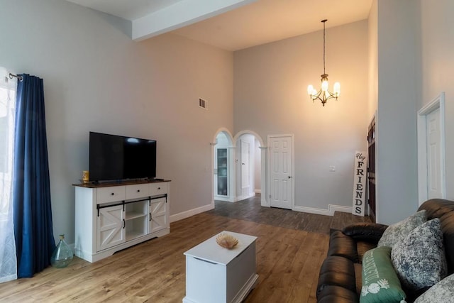 1242 Pleasant Hill St, Escondido, CA 92026 - living room with high vaulted ceiling, a chandelier, wood finished floors, beam ceiling, and baseboards