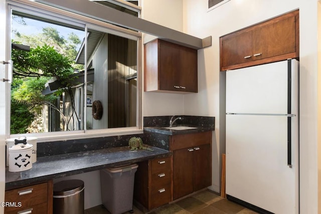 2279 Midwick Dr, Altadena, CA 91001 - kitchen with freestanding refrigerator, dark stone counters, and a sink