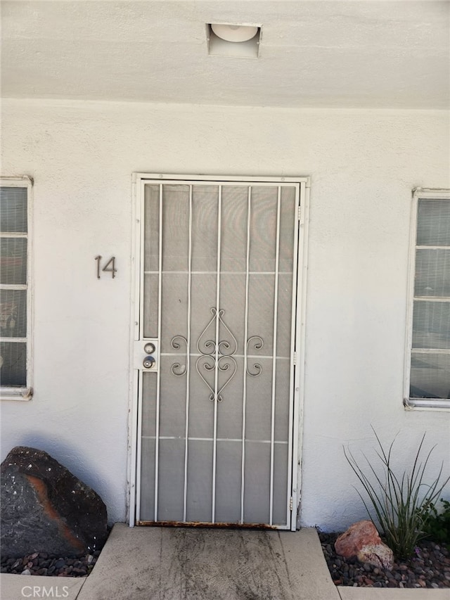 314 E Stevens Rd Unit 14, Palm Springs, CA 92262 - view of exterior entry featuring stucco siding