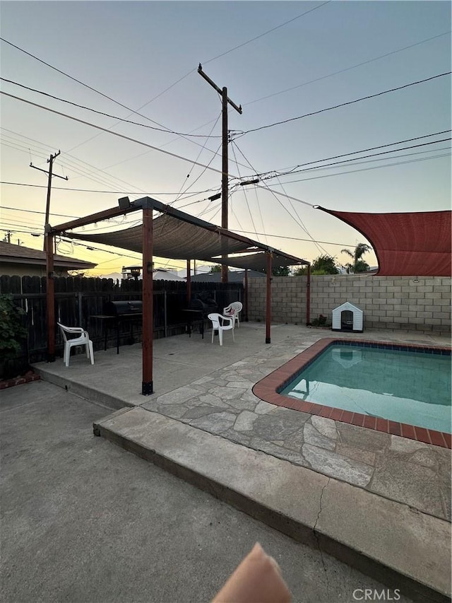 907 E Ghent St, Azusa, CA 91702 - pool at dusk with a gazebo, a patio, and a fenced backyard