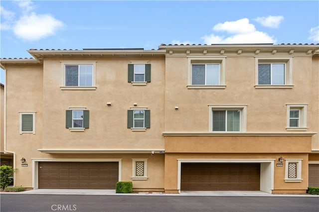 8254 Traveller St, Chino, CA 91708 - back of property featuring stucco siding and an attached garage