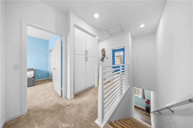 8254 Traveller St, Chino, CA 91708 - hall with attic access, baseboards, an upstairs landing, light carpet, and recessed lighting
