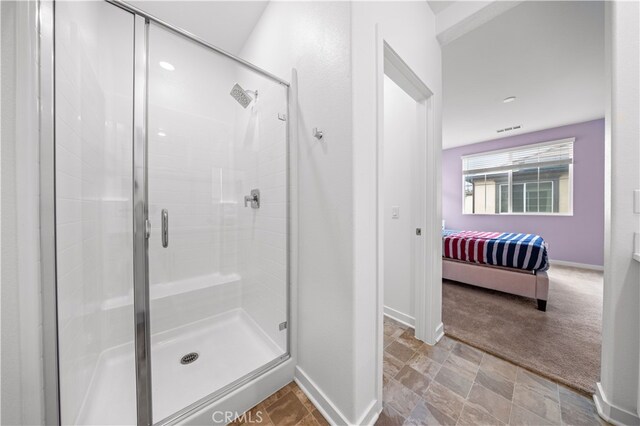 8254 Traveller St, Chino, CA 91708 - bathroom with a shower stall, connected bathroom, and baseboards