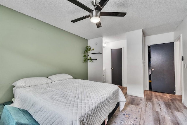 744 W Lambert Rd Unit 51, La Habra, CA 90631 - bedroom featuring wood finished floors, a textured ceiling, and ceiling fan