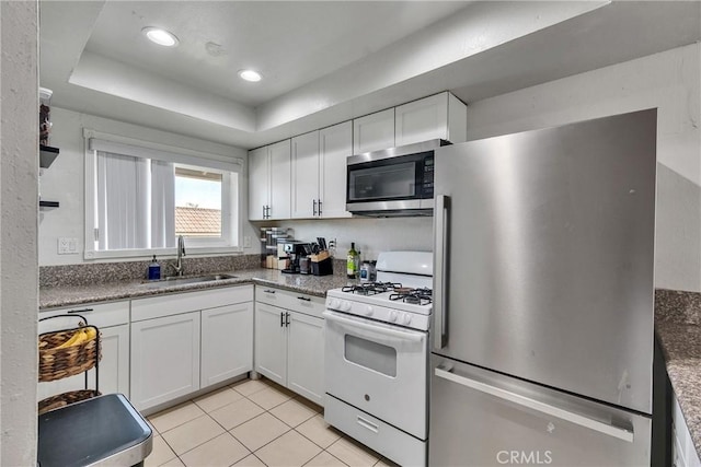 744 W Lambert Rd Unit 51, La Habra, CA 90631 - kitchen featuring appliances with stainless steel finishes, white cabinetry, light tile patterned flooring, and recessed lighting
