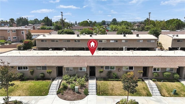 744 W Lambert Rd Unit 51, La Habra, CA 90631 - view of building exterior with a residential view