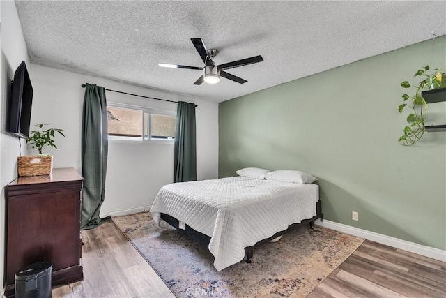 744 W Lambert Rd Unit 51, La Habra, CA 90631 - bedroom featuring a textured ceiling, wood finished floors, and ceiling fan