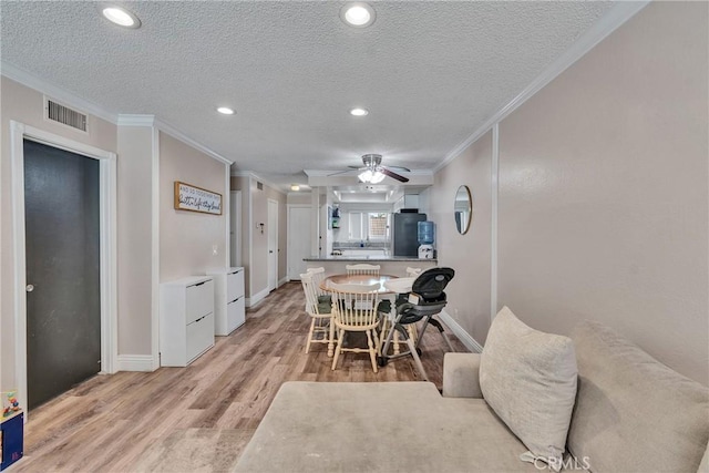 744 W Lambert Rd Unit 51, La Habra, CA 90631 - dining room featuring ornamental molding, light wood-style floors, a textured ceiling, recessed lighting, and ceiling fan