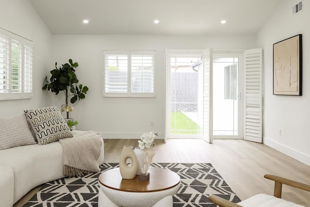 4380 Rolfe Rd, San Diego, CA 92117 - living room featuring wood finished floors, baseboards, and recessed lighting
