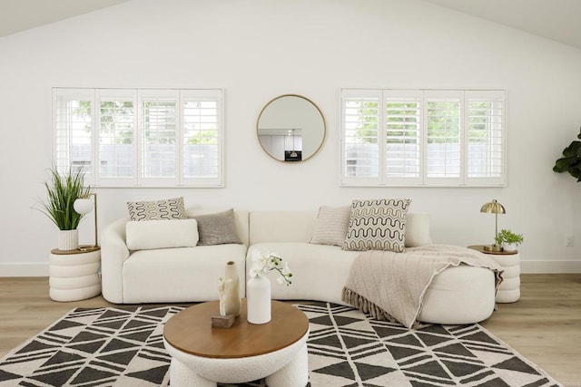 4380 Rolfe Rd, San Diego, CA 92117 - living area with healthy amount of natural light, wood finished floors, baseboards, and high vaulted ceiling