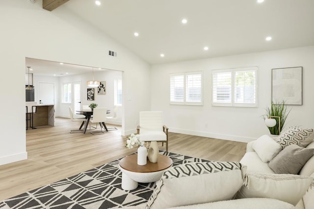 4380 Rolfe Rd, San Diego, CA 92117 - living area with light wood finished floors, recessed lighting, baseboards, and high vaulted ceiling