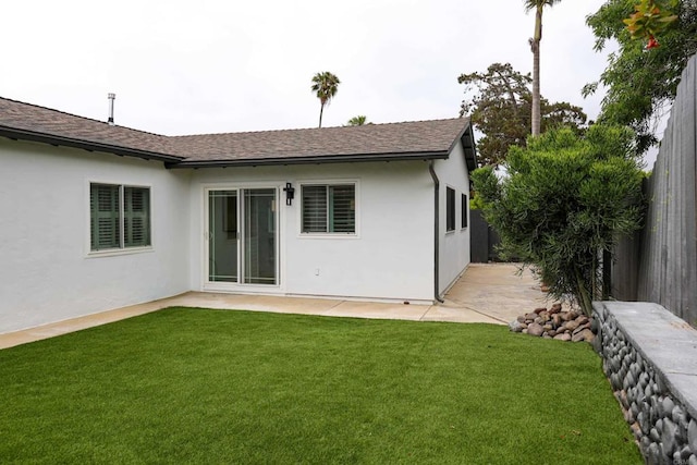 4380 Rolfe Rd, San Diego, CA 92117 - back of property featuring a shingled roof, stucco siding, and a patio