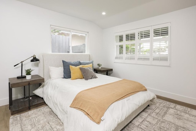 4380 Rolfe Rd, San Diego, CA 92117 - bedroom with baseboards, wood finished floors, multiple windows, lofted ceiling, and recessed lighting