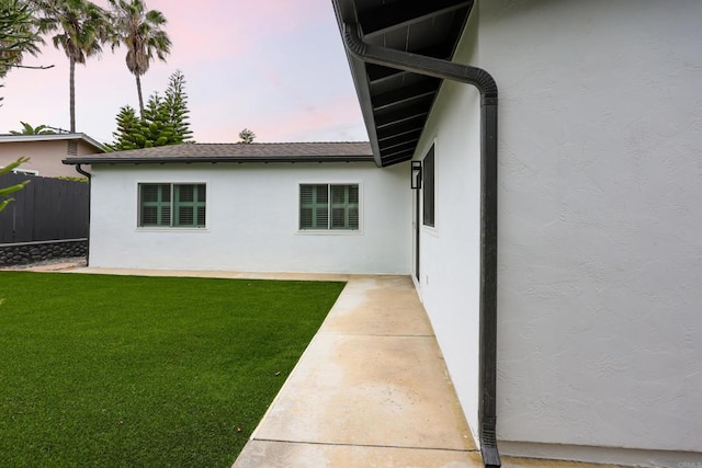 4380 Rolfe Rd, San Diego, CA 92117 - back of house at dusk featuring stucco siding