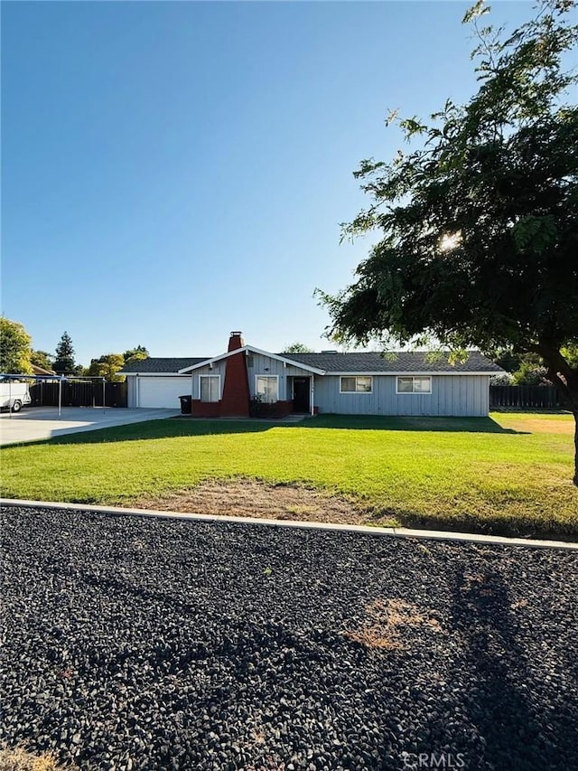 12236 Gabor Way, Madera, CA 93636 - view of front of house featuring driveway, board and batten siding, and a chimney