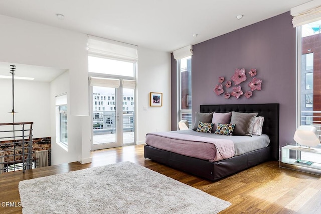 940 E 2nd St Unit 37, Los Angeles, CA 90012 - bedroom with access to outside and wood finished floors