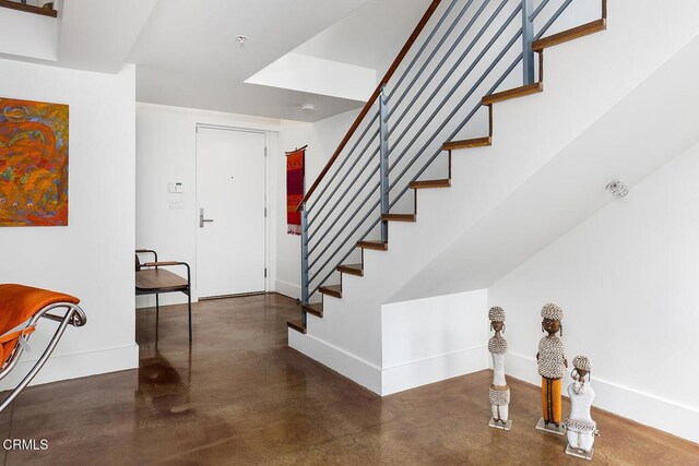 940 E 2nd St Unit 37, Los Angeles, CA 90012 - entryway featuring finished concrete floors and stairway