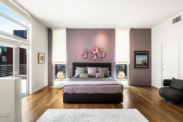 940 E 2nd St Unit 37, Los Angeles, CA 90012 - bedroom with wood finished floors and baseboards