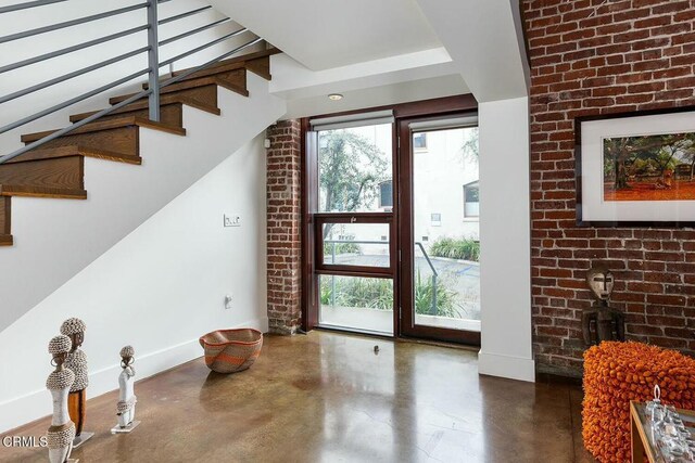 940 E 2nd St Unit 37, Los Angeles, CA 90012 - foyer featuring finished concrete floors and stairway