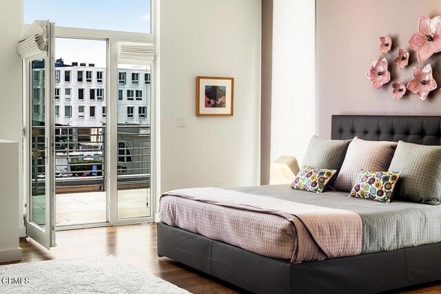 940 E 2nd St Unit 37, Los Angeles, CA 90012 - bedroom featuring access to outside and wood finished floors