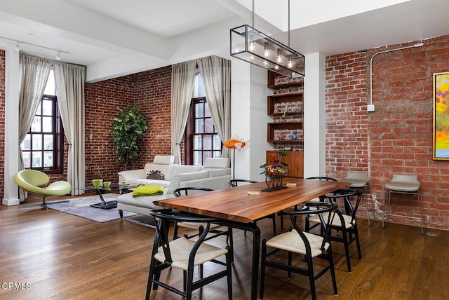 940 E 2nd St Unit 37, Los Angeles, CA 90012 - dining space with brick wall and wood finished floors