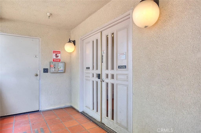 430 N Holliston Ave Unit 210, Pasadena, CA 91106 - tiled entrance foyer featuring a textured wall and a textured ceiling